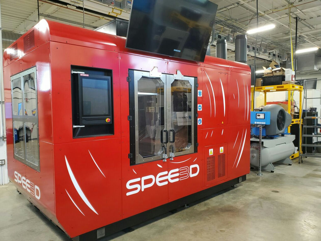 The WarpSPEE3D printer, recently purchased by Missouri S&T, builds parts by firing, at supersonic speeds, millions of metallic particles onto a build platform with assistance from a robot that controls the direction of the projection of particles to rapidly build the part. Photo courtesy of Bradley Deuser, Missouri S&T.