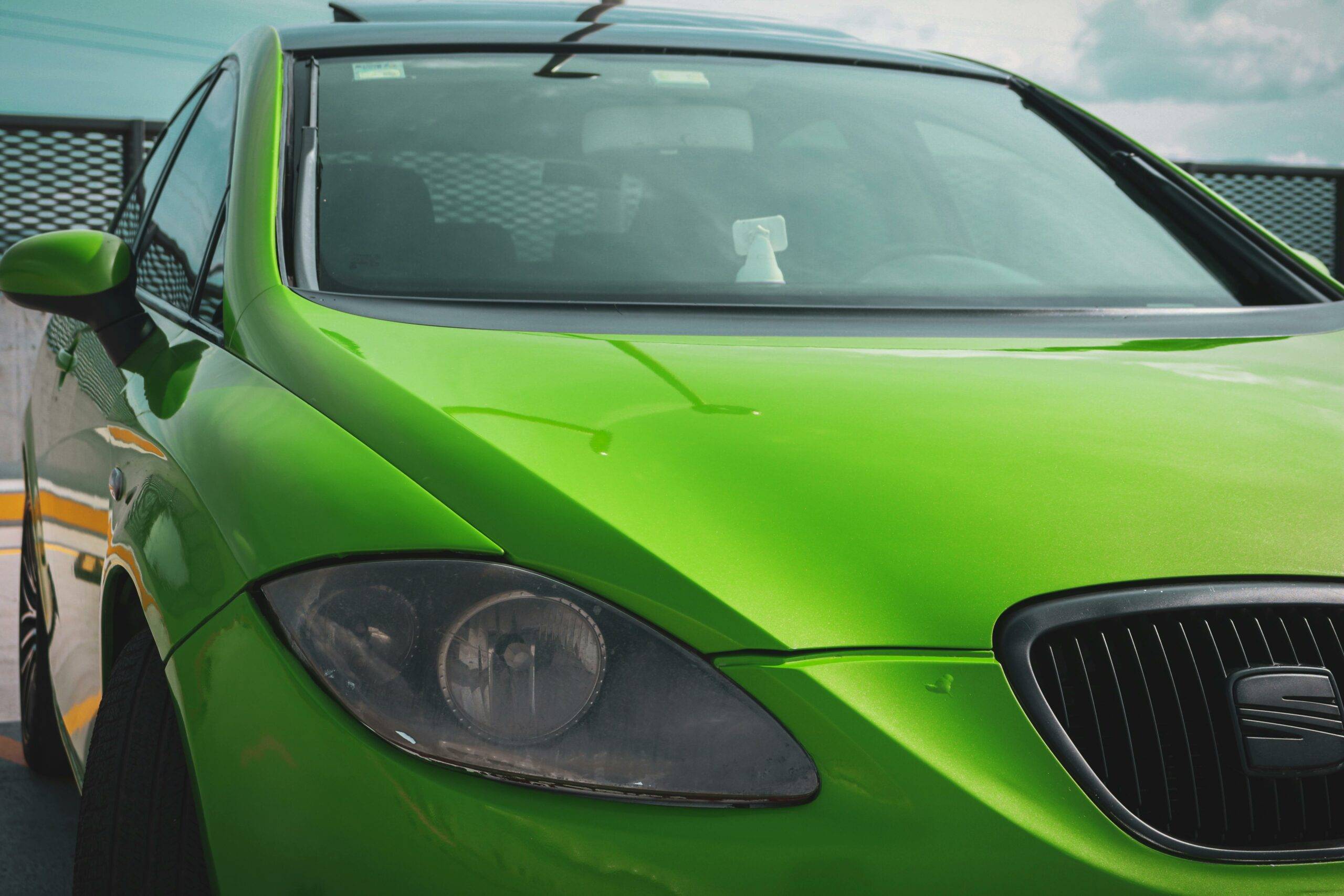 free photo of a green car with a green hood and green paint scaled