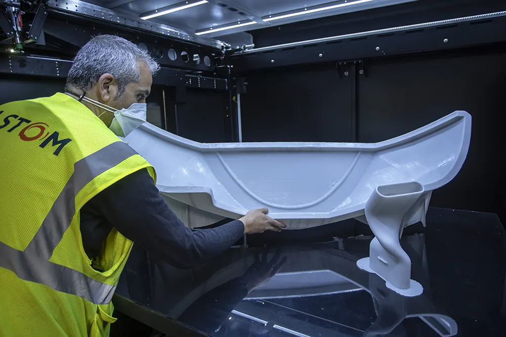 Alstom Employee working on a 3D printed part