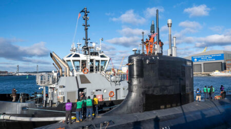 Sailors aboard the Virginia-class attack submarine USS Texas prepare to depart Portsmouth Naval Shipyard after critical repairs and system upgrades. As the Navy works to enhance fleet readiness and extend the service life of submarines like Texas, APL researchers are partnering with the Naval Sea Systems Command to advance additive manufacturing processes — such as laser powder bed fusion — to deliver consistent, mission-ready components and reduce logistics delays across the fleet.